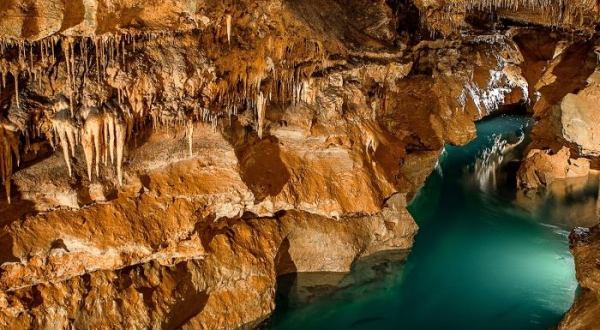 Most People Don’t Know There’s A Stunning Sapphire Lake Hiding Inside Cosmic Cavern in Arkansas