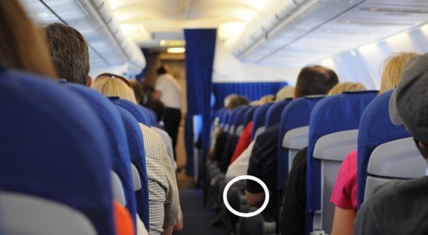 Press This Secret Button On Your Airplane Seat To Get More Room