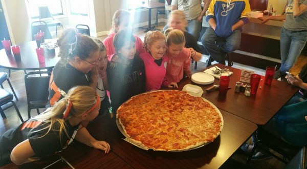 The Pizza At This Delicious Missouri Eatery Is Bigger Than The Table