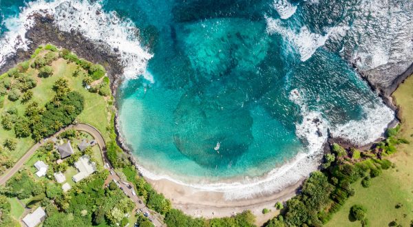 This Crescent Beach Backed By Cliffs Is Our New Favorite Hawaii Destination