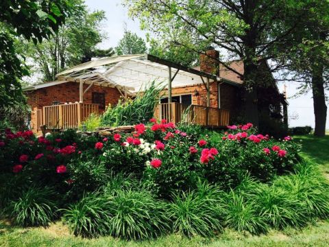 This Farmhouse Bed & Breakfast In Illinois Has A Picturesque Back Porch That Is Perfect For Summer