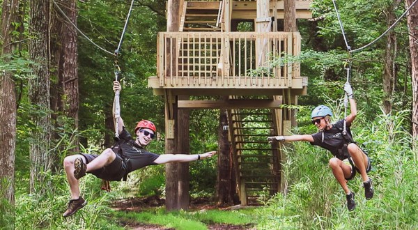 Zipline Through A Canopy Of Colorful Changing Leaves At Adventureworks Near Nashville