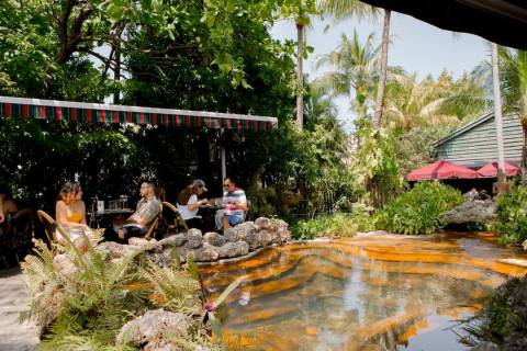 Dine In Style Beside A Tropical Lagoon At Cafe Roval Restaurant In Florida
