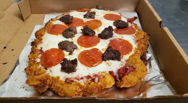 Get Your Favorite Pizza On Top Of A Breaded Tenderloin At Flo’s, A Hometown Bar & Grill In Illinois