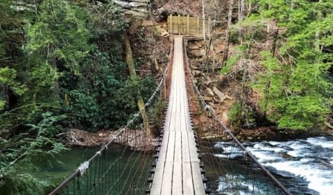 Walk Across A 150-Foot Suspension Bridge Near Cane Creek Falls In Tennessee