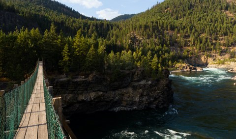See The State's Largest Waterfall From This Swinging Bridge In Montana