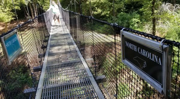 Walk Across The Carolinas Border On A Daring 180-Foot Suspension Bridge On The Carolina Thread Trail In North Carolina