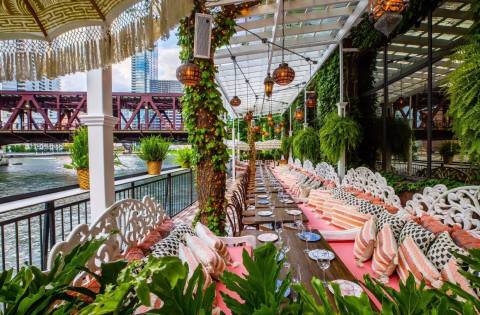 Dine Along The Water On The Covered Patio At Beatnik On The River, A Bohemian Restaurant In Illinois