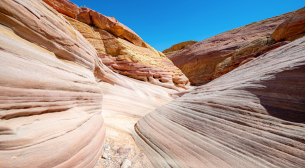 You’ll Be Immersed In Brilliant Pastel Colors When You Hike Through Pink Canyon In Nevada