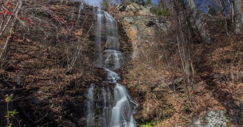 Marvel At A 150-Foot Roadside Waterfall When You Take A Scenic Drive On White Oak Mountain Road In North Carolina