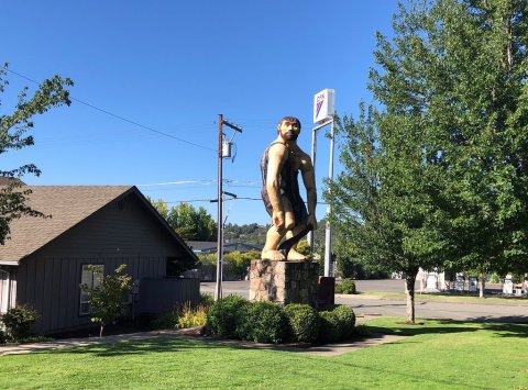 The Grant's Pass Caveman In Oregon Just Might Be The Strangest Roadside Attraction Yet