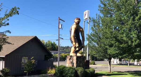 The Grant’s Pass Caveman In Oregon Just Might Be The Strangest Roadside Attraction Yet