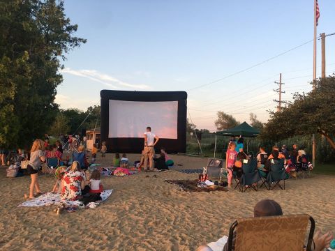 Watch Movies Outdoors On A Picnic Blanket In The Village Of Clarkson Near Detroit This Summer