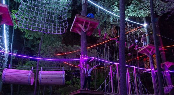 Climb Among Colorful Lights During Glow Nights At TreeRunner Adventure Park In Michigan