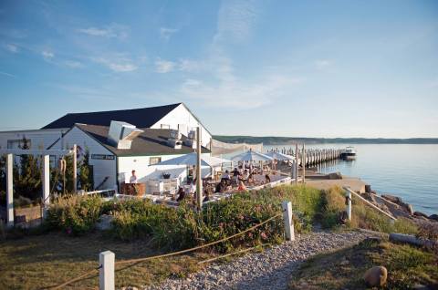 Enjoy The Scenic Views Of Fort Pond Bay From Duryea’s Lobster Deck In New York
