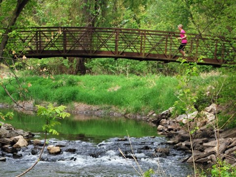 Take The Clive Greenbelt Trail For An Out-Of-This-World Hike In Iowa That Leads To A Fairytale Foot Bridge