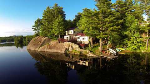 Forget The Resorts, Rent This Charming Waterfront Cottage In New Hampshire Instead