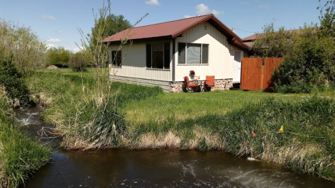 Stay In This Cozy Little Creekside Cabin In Montana For Less Than $150 Per Night