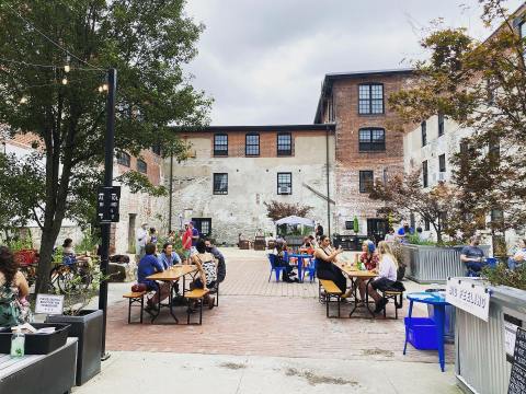 Enjoy A Cocktail And A Good Book On The Patio At Riffraff Bookstore And Bar In Rhode Island