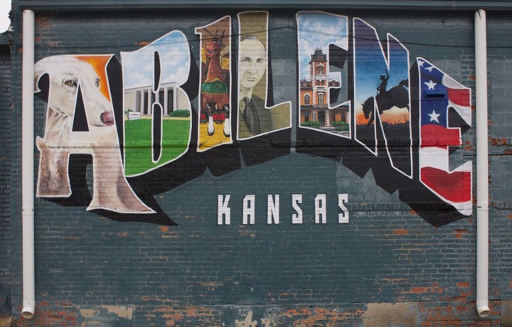 A painted Abilene, Kansas mural similar to a postcard.