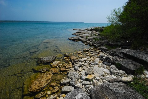 Hike Through A Forest To A Cobblestone Shoreline At Wisconsin's Often-Overlooked Toft Point State Natural Area