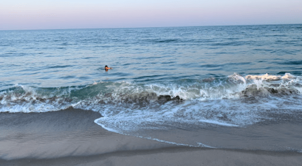 Relax On Golden Sand At Charlestown Breachway In Rhode Island