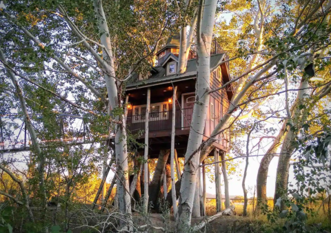 Cross A 70-Foot Suspension Bridge To This Adorable Utah Treehouse