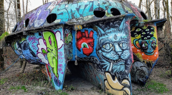 The Abandoned UFO Boat On Oregon’s Collins Beach Is A Graffiti Masterpiece