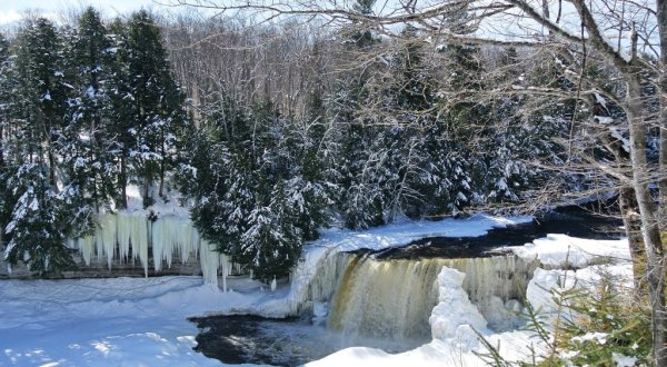 Take A Whimsical Winter Waterfall Trek To The Frozen Tahquamenon Falls In Michigan