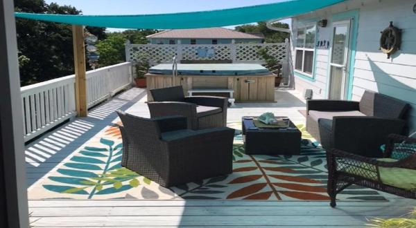Enjoy Your Own Hot Tub, Game Room, And Tiki Bar At The Island House In Mississippi