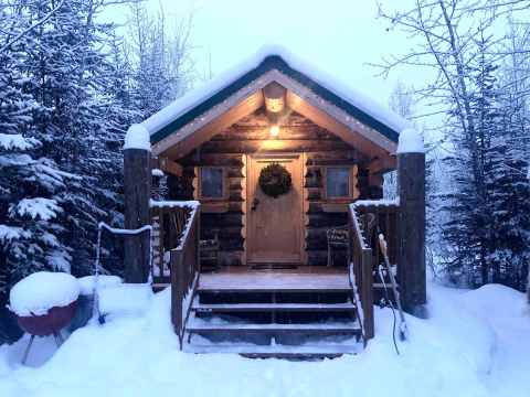 Cozy Up In This Tiny Cabin In Interior Alaska As You Watch The Snow Fall Through The Boreal Forest