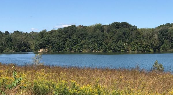 The Underrated Lake Border Trail In Pennsylvania Leads To A Turquoise Lake