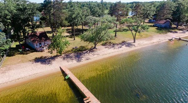 This Little Cottage On Wolf Lake Is Steps Away From A Sandy Beach, And You Can Spend The Night