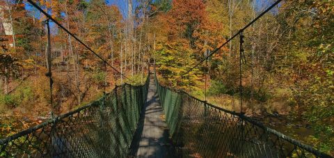 Walk Across A Suspension Bridge On Keystone College Trail In Pennsylvania