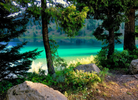Visit Wade Lake In Montana, A Hidden Gem Beach That Has Glistening Blue Water