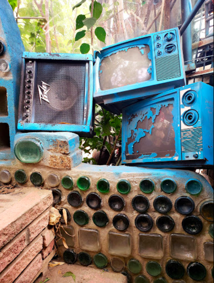 blue televisions in cathedral of junk