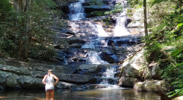 Wade Under A Waterfall Along The Emery Creek Falls Trail In Georgia