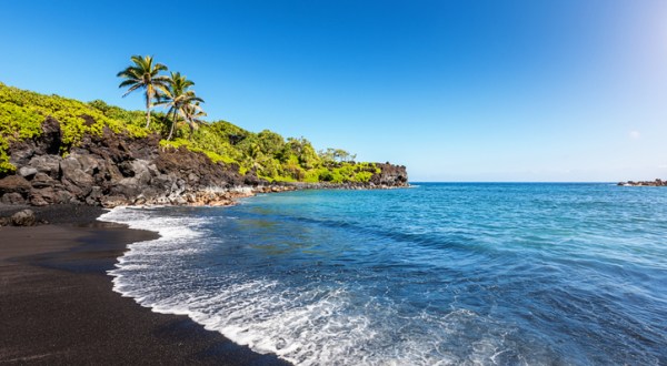 Visit Honokalani Black Sand Beach In Hawaii, A Hidden Gem Beach That Has Its Very Own Lava Tube