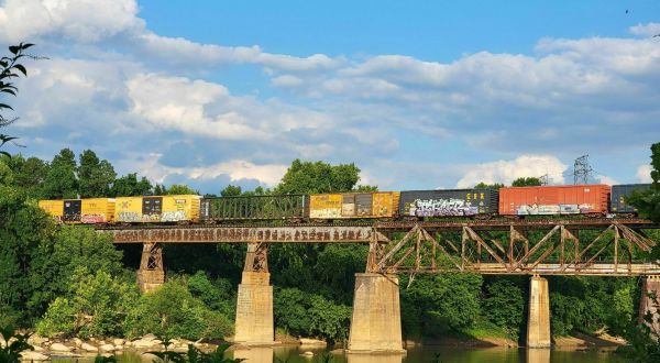 Watch Trains Roll Over The Trestle On A Casual Stroll Along The River In South Carolina