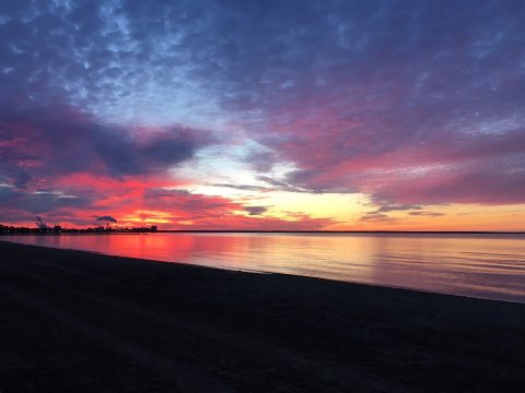 ​Watch The Sunrise At Bay View Park, A Unique East-Facing Beach In Michigan