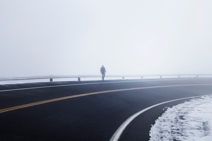 Foggy, spooky figure walking along a guardrail in Lewiston Idaho