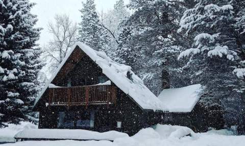This Cozy Cabin That's Next To A River Is The Most Picturesque Place To Stay In Idaho This Winter