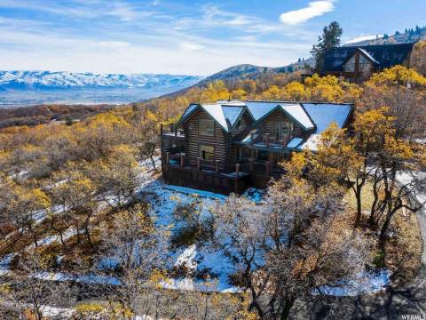 Snuggle Next To The Fireplace Or Soak In The Hot Tub During A Winter Getaway To This Charming Cabin In Utah
