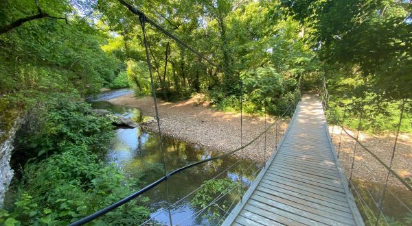 Walk Across A Suspension Bridge On Tanyard Creek Nature Trail In Arkansas
