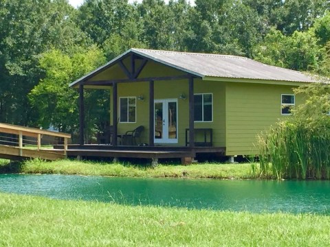 Forget The Resorts, Rent This Charming Waterfront Cottage In Louisiana Instead