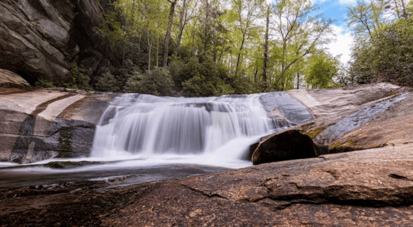 Hike Less Than A Mile To This Spectacular Towering Cliff And Waterfall In North Carolina