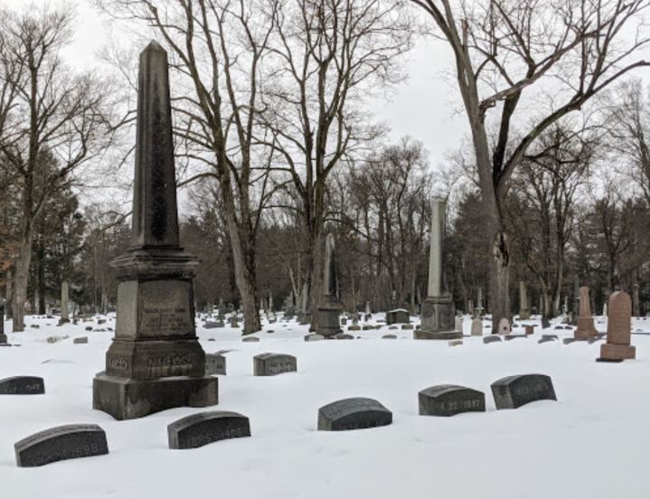 Snow-covered headstones at Woodlawn Cemetery in Elmira, New York. Elmira is called one of New York's most haunted small towns.