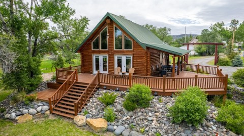 This Riverfront Log Cabin VRBO In Wyoming Is One Of The Coolest Places To Spend The Night