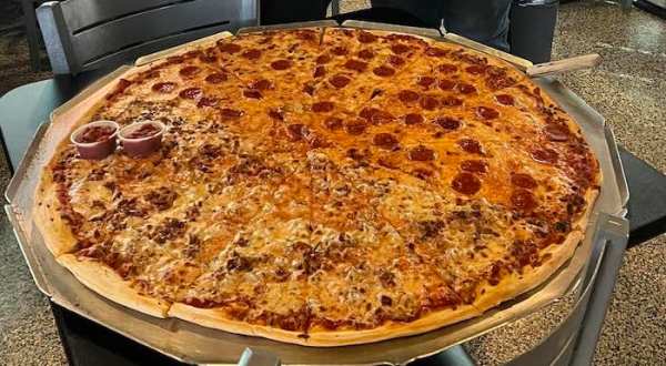The Pizza At This Delicious Iowa Eatery Is Bigger Than The Table