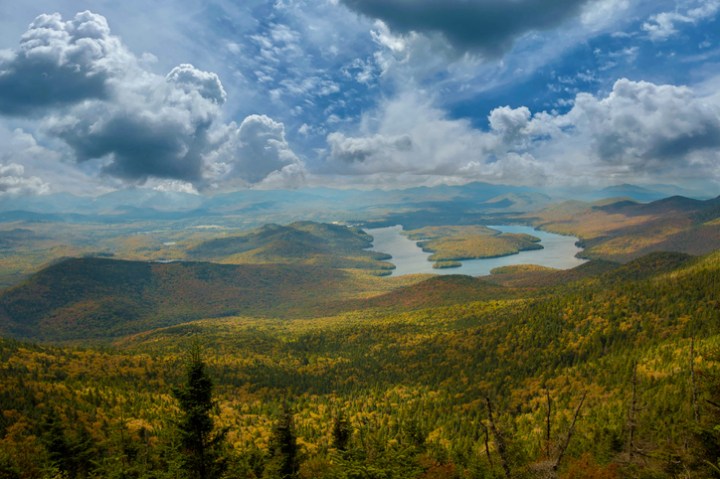 Aerial view of Lake Placid in New York, weaving through rolling green hills.